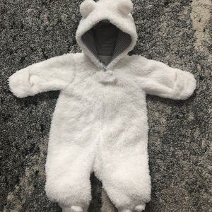 White Sherpa like bodysuit.